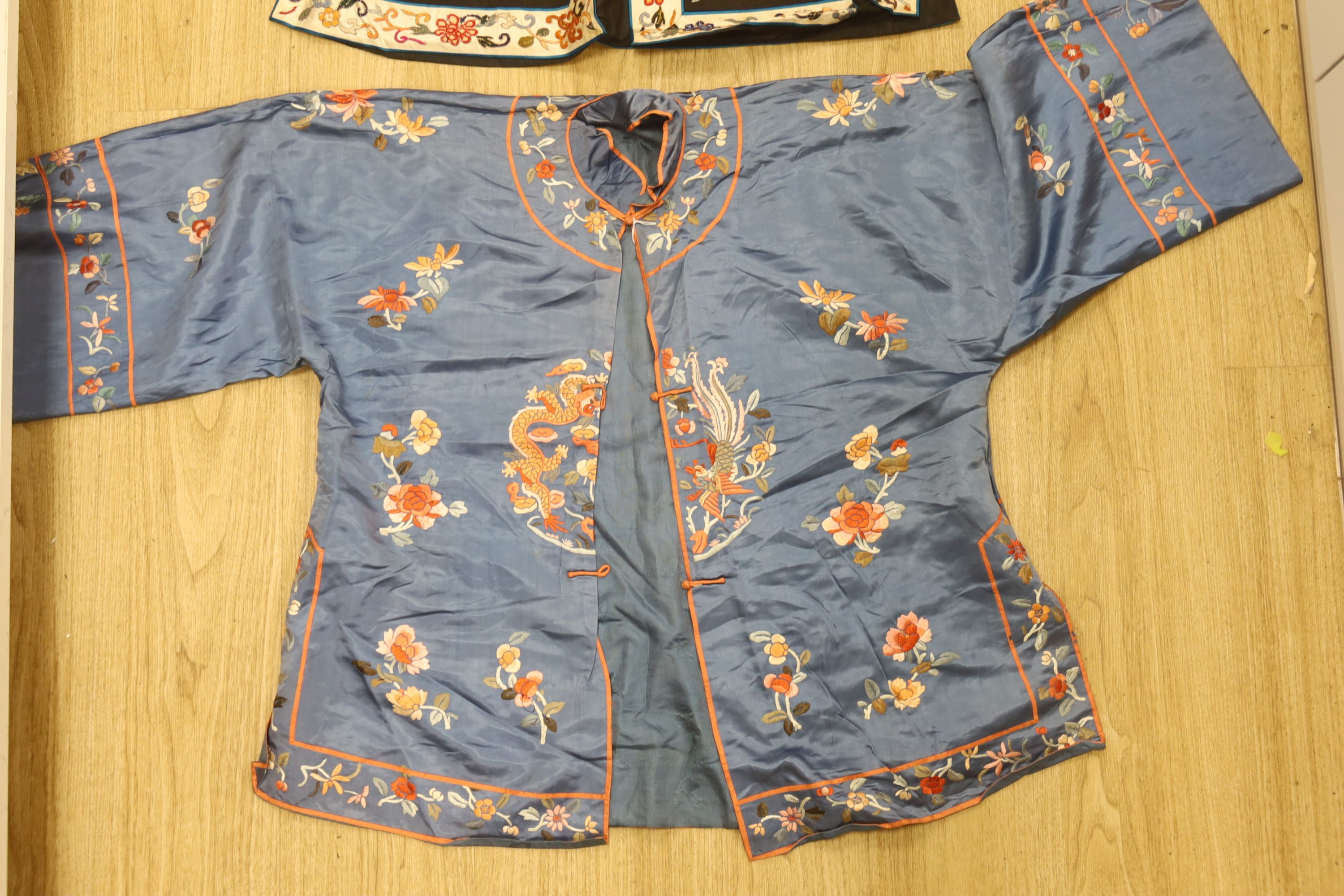 A 1930's Chinese embroidered jacket, embroidered with dragons and a black silk embroidered jacket with Chinese knotting